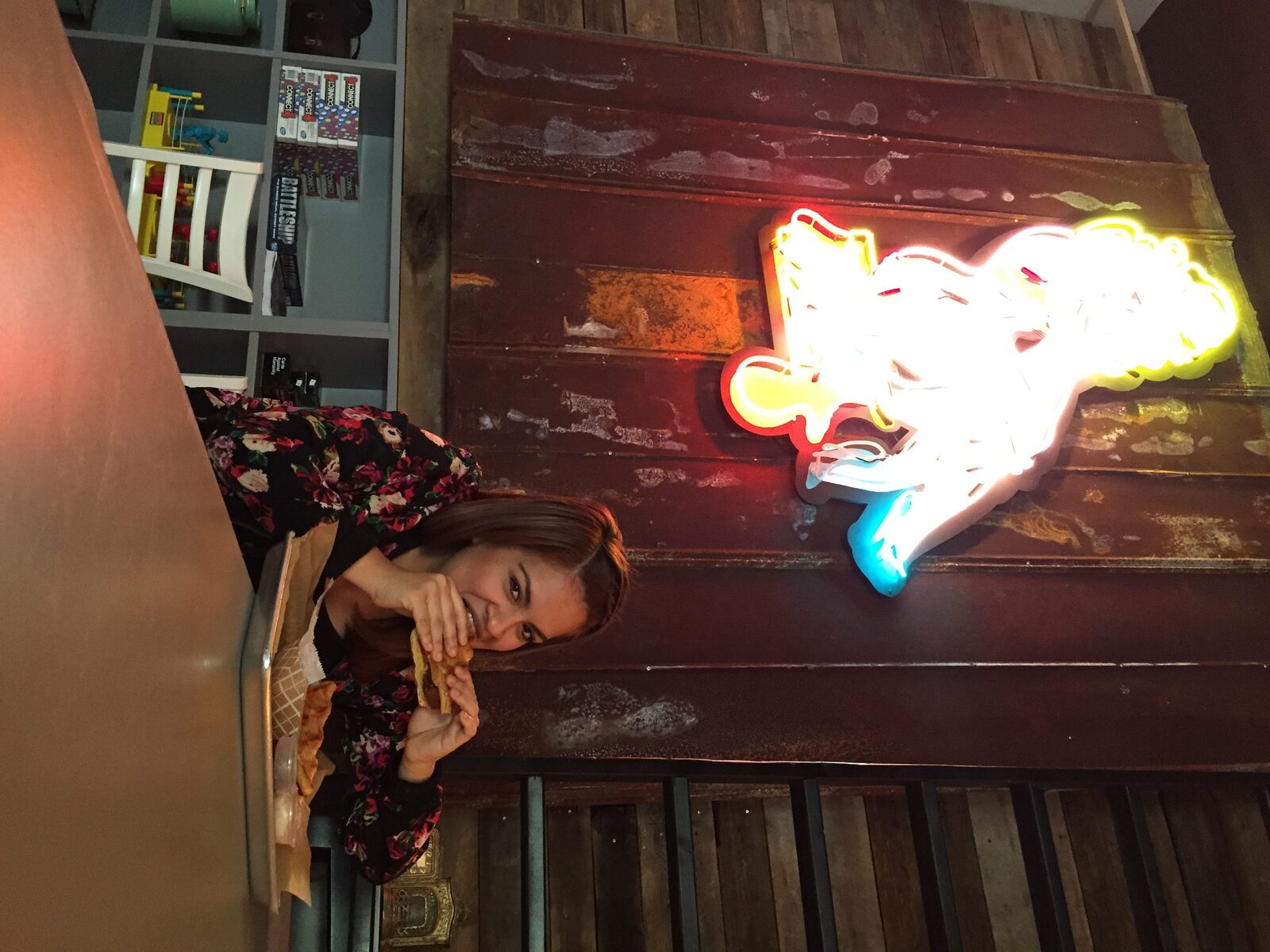 Rosa eating the popular Southern Fried Chicken and Waffle from Ms. Cheezious